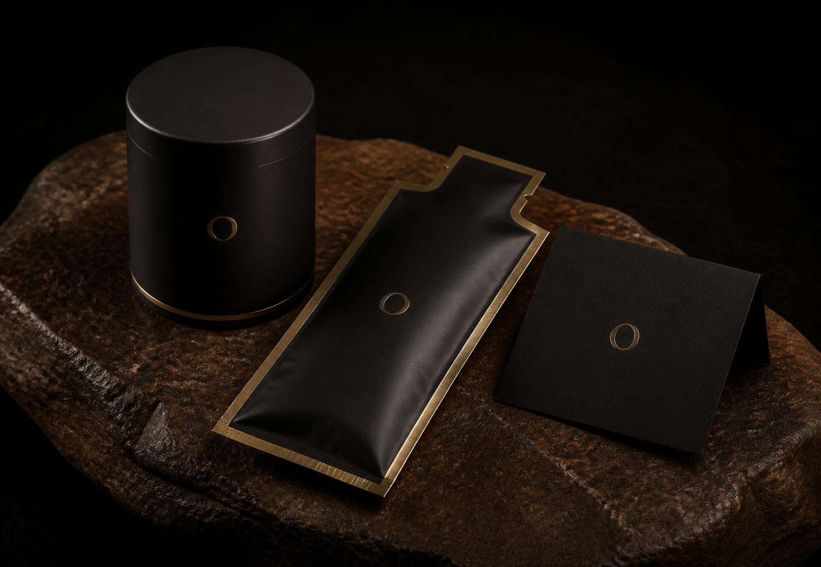 OPTIMAL jar, gold-edged refill pouch and welcome card arranged on dark stone